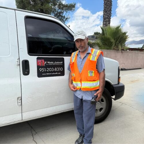 Automotive locksmith San Bernardino cutting a new car key