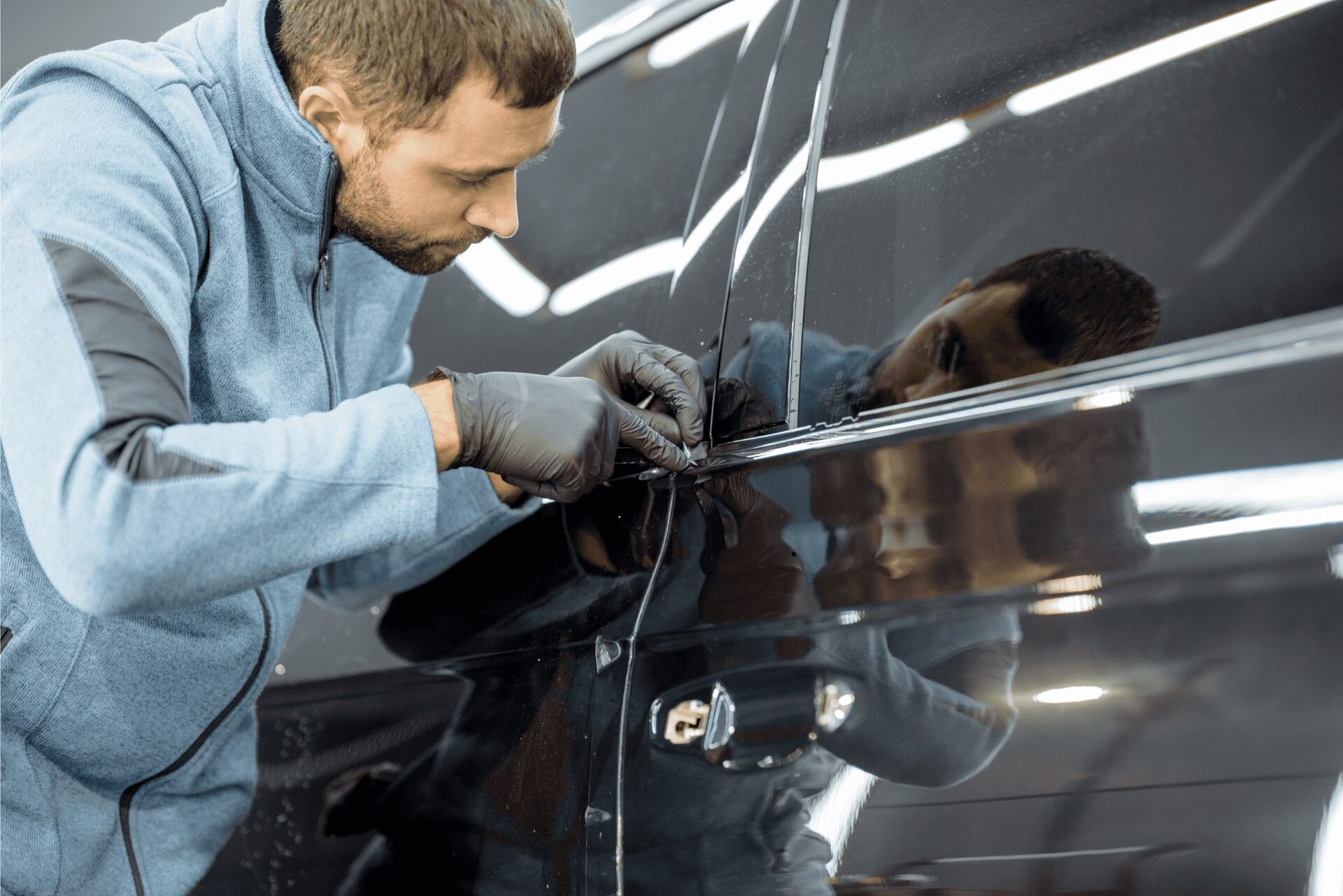 car lockout service in San Bernardino by A+ Mobile Locksmith technician unlocking vehicle